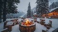 Cozy Fire Pit Amidst Snowy Mountains and Rustic Cabin Royalty Free Stock Photo