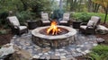Cozy firepit surrounded by stylish outdoor chairs.. Royalty Free Stock Photo