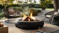 Cozy firepit surrounded by stylish outdoor chairs.. Royalty Free Stock Photo