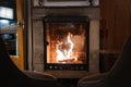 Cozy Fireplace Setting with Armchairs by Stone Mantel Royalty Free Stock Photo