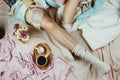 Cozy flatlay with white tanned woman in white socks sitting in h