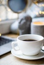 Cozy freelancer`s winter work place at home with cup of coffee