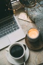 Cozy freelancer`s winter work place at home with cup of coffee