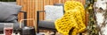 Garden with grey armchairs, yellow blanket and kettle and g