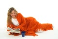 Cozy girl reading a book, smiling Royalty Free Stock Photo