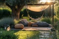 Cozy green garden lawn with wooden furniture, soft colorful pillows and blankets, sunshade and flowering plants. Charming sunny