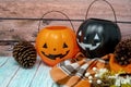 Cozy Halloween autumn concept background with pumpkin trick or treat buckets, plaid blanket