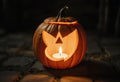 Detailed Close-Up of a Jack-o\'-Lantern with a Burning Candle Inside, Casting a Warm Light and Emphasizing Texture Royalty Free Stock Photo