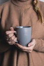 Cozy home. Female hands holding hot cup of tea. Royalty Free Stock Photo