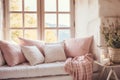 Cozy home place, pink and white pillows and blanket on sofa near window. French country, farmhouse interior design