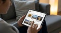 Cozy home scrolling social feed on digital tablet Royalty Free Stock Photo