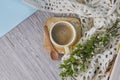 Cozy home still life: cup of hot coffee, spring flowers and opened book with warm plaid. Springtime concept, free copy Royalty Free Stock Photo