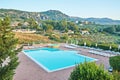 Cozy hotel lounge zone with swimming pool hidden among mountains