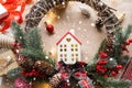 Cozy house in Christmas decor layout, warm knitted scarf, hat, winterization. Winter, snow - home insulation, protection from cold