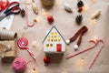 Cozy house in Christmas decor layout, warm knitted scarf, hat, winterization. Winter, snow - home insulation, protection from cold