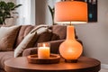 Cozy Illumination: Peach Retro Lamp and Candles on a Small Wooden Table