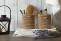 Cozy interior in the bathroom with white towels, lavender and hand-knitted jute boxes for accessories and cosmetics, eco-friendly Royalty Free Stock Photo