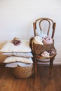 cozy interior details, scandinavian mininalistic lifestyle. Organizing clothes in wicker backets