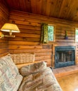 Cozy interior of a rustic log cabin Royalty Free Stock Photo