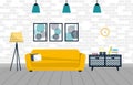 Cozy interior with yellow sofa, paintings, lamp and nightstand with books and candles