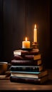 A stack of books on a wooden table with a cup of coffee and a candle, representing reading and relaxation