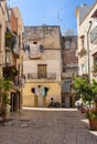 Cozy italian backyard with balcony, drying clothes and motorcycle. Traditional mediterranean architecture. Italian town landmark. Royalty Free Stock Photo