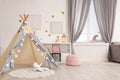 Cozy kids room interior with play tent Royalty Free Stock Photo