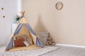 Cozy kids room interior with play tent and toys Royalty Free Stock Photo