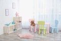 Cozy kids room interior with table, chairs