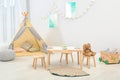 Cozy kids room interior with table Royalty Free Stock Photo