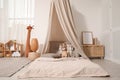 Cozy kids room with play tent, toys and floor bed. Montessori interior Royalty Free Stock Photo