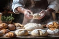In a cozy kitchen, an artisan baker spends the afternoon skillfully shaping fresh bread on a rustic wooden table Royalty Free Stock Photo