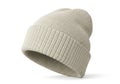 A cozy knitted beige beanie hat with a ribbed texture isolated on white background Royalty Free Stock Photo