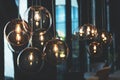 Cozy light bulbs in dark and moody cafe. Royalty Free Stock Photo