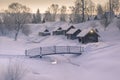 Cozy little houses on hill morning of winter village around frozen river