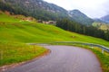 Cozy little mountain village in the Dolomites near Santa Barbara church on a foggy morning, La Valle Alta Badia, South Tyrol Royalty Free Stock Photo