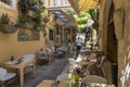 Cozy little restaurants with lots of flowers and plants on Radamathios street in the old town of Rethymno, Crete, Greece Royalty Free Stock Photo