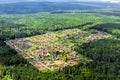 The cozy little village in the middle of taiga forest. Airview