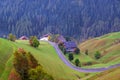 Cozy little village near the church of Santa Barbara on a foggy morning, La Valle, Alta Badia, South Tyrol Royalty Free Stock Photo