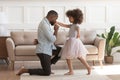 African father got down on knee kisses hand of daughter