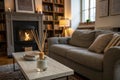 Cozy living room interior with grey sofa and reed diffuser Royalty Free Stock Photo