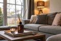 Cozy living room with grey sofa and reed diffuser Royalty Free Stock Photo
