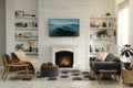 Cozy living room interior with sofa, armchairs and decorative fireplace Royalty Free Stock Photo