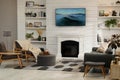 Cozy living room interior with comfortable sofa, armchairs and decorative fireplace Royalty Free Stock Photo