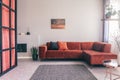 Cozy living room interior with corner sofa with pillows and painting on the wall Royalty Free Stock Photo