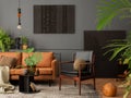 Cozy living room interior with mock up poster frame, brown sofa, leather armchair, black coffee table, books, plants in flowerpots Royalty Free Stock Photo