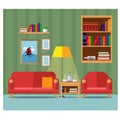 Cozy living room with a sofa, an armchair, a bookcase and a table for tea. Royalty Free Stock Photo