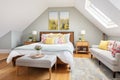 cozy loft bedroom in modernized saltbox interior Royalty Free Stock Photo