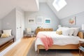 cozy loft bedroom in modernized saltbox interior Royalty Free Stock Photo