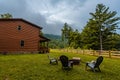 Cozy Log cabin home in Mountain North Carolina. Fire pit. Outdoor fire pit. Cloudy or foggy morning. Forest